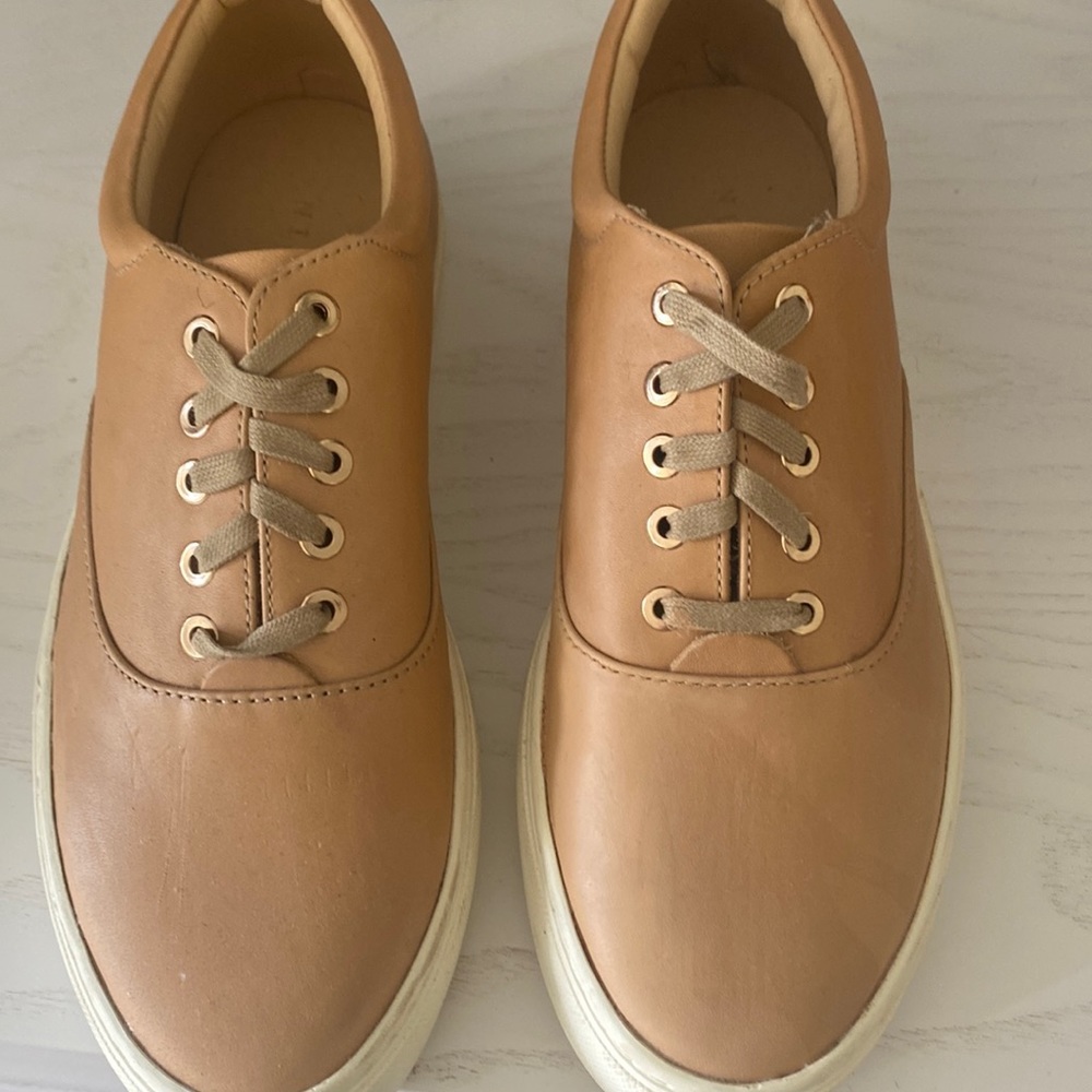 Sneakers size 7, runs small. Tan.